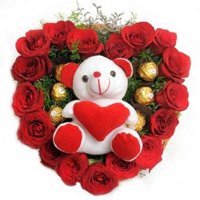 Wedding Flowers to India. Send 18 Red Roses and 5 Ferrero Rocher to Guwahati with Teddy Heart