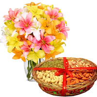 Deliver 10 Mix Lily Vase, 1 Kg Mix Dry Fruits with Rakhi gifts to India