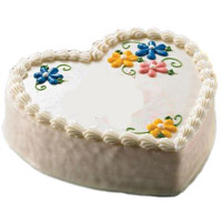 Deliver Rakhi to Delhi for brother and 1 Kg Heart Shape Vanilla Cakes to Bangalore