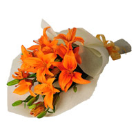 Flowers to India on Diwali. Orange Lily Bouquet 4 Flower Stems