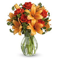 Online Diwali Flowers Delivery in Delhi. Orange Lily Red Roses in Vase 12 Flowers to India