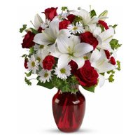 Best Rakhi Flower Delivery in India. 2 White Lily 6 White Gerbera 6 Red Roses Vase