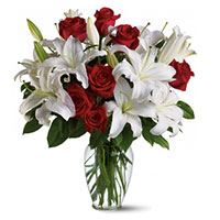 Place Order for Rakhi Flowers to India. 4 White Lily 12 Red Roses to India in Vase