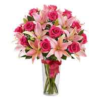 Order Online Flower Delivery in India. 4 Pink Lily 15 Pink Rose in Vase on Rakhi