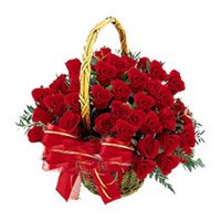 Durga Puja Flowers Delivery to India. Red Roses Basket 24 Flowers to Bhopal
