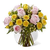 Buy New Born Flowers in India. Yellow Pink Roses Vase 18 Flowers Delivery in India