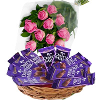 Send Gifts to India Online that includes 12 Pink Roses with Dairy Milk Basket 12 Chocolates in Kozhikode