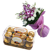 Order for Newborn Chocolates in India. Send 8 Orchids 12 White Rose Bouquet 16 Pcs Ferrero Rocher Chocolates to India