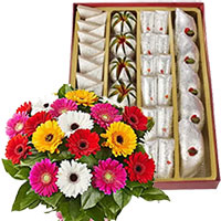 Send Diwali Sweets to India. 500 gm Assorted Kaju Sweets with 12 Mix Gerbera Flowers Gifts to India