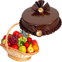 Deliver Rakhi Gifts of 1 Kg Fresh Fruits Basket with 500 gm Chocolate Truffle Cake to India