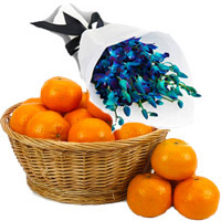 Online Rakhi Gifts of Blue Orchid Bunch 10 Flowers Stem with 18 pcs Fresh Orange Fruits to India