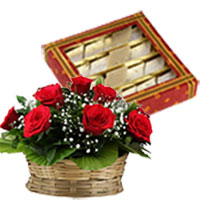 Buy Diwali Gifts to India. 500 gm Kaju Katli with Basket of 12 Red Roses in India