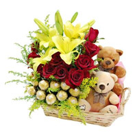 Best Gifts Delivery in India including 2 Lily 12 Roses with 16 Ferrero Rocher and Twin Small Teddy Basket