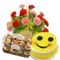 Online Gifts Delivery in Trivandrum. 15 Red Pink Carnation Basket with 16 pcs Ferrero Rocher and 1 Kg Smiley Cakes India